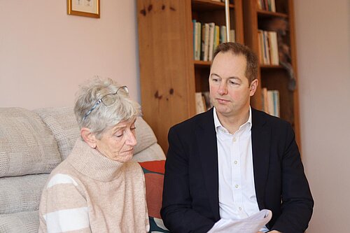 Richard Foord sat in a living room talking to a lady