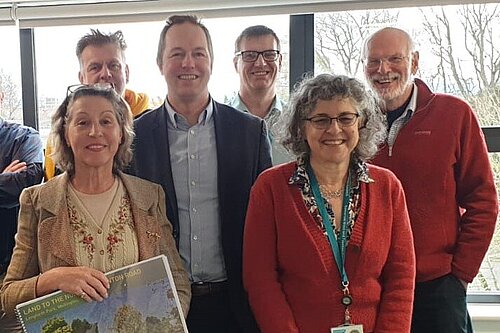 Richard Foord standing with members of the Cullompton Railway Station Metro Board