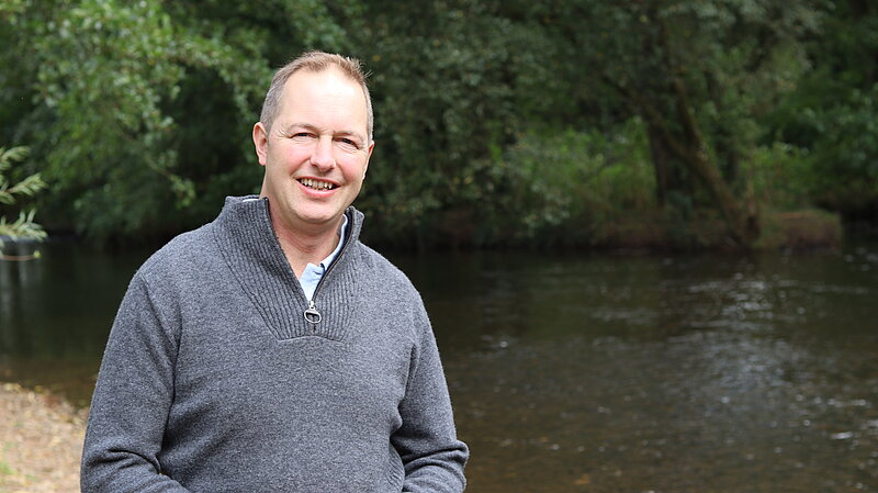 Richard Foord standing in front of a river