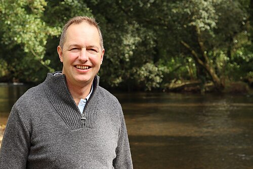 Richard Foord stood by a local river