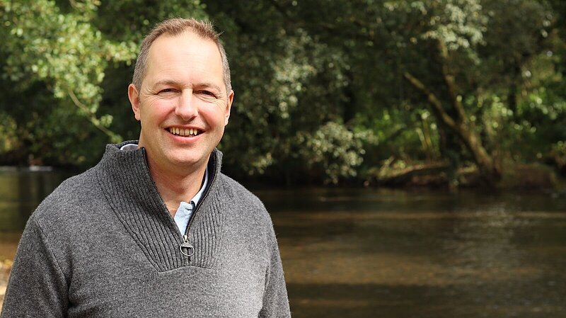 Richard Foord stood by a local river
